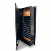 Daboujiebar The Lash Testament D Curl lash trays in a black book-shaped case. Features dark, lifted lashes.