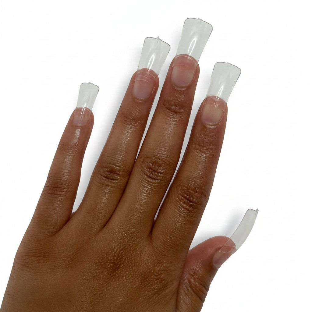 Daboujiebar Duck Tips clear acrylic nail extensions with a flared, retro design. Available in Long and XXL sizes.